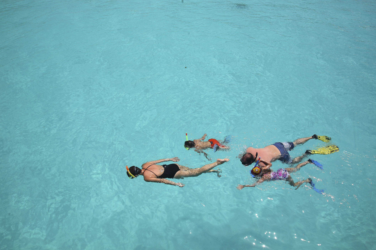 Beyond Zanzibar Mnemba island Experience snorkelling kids and family in the water 1