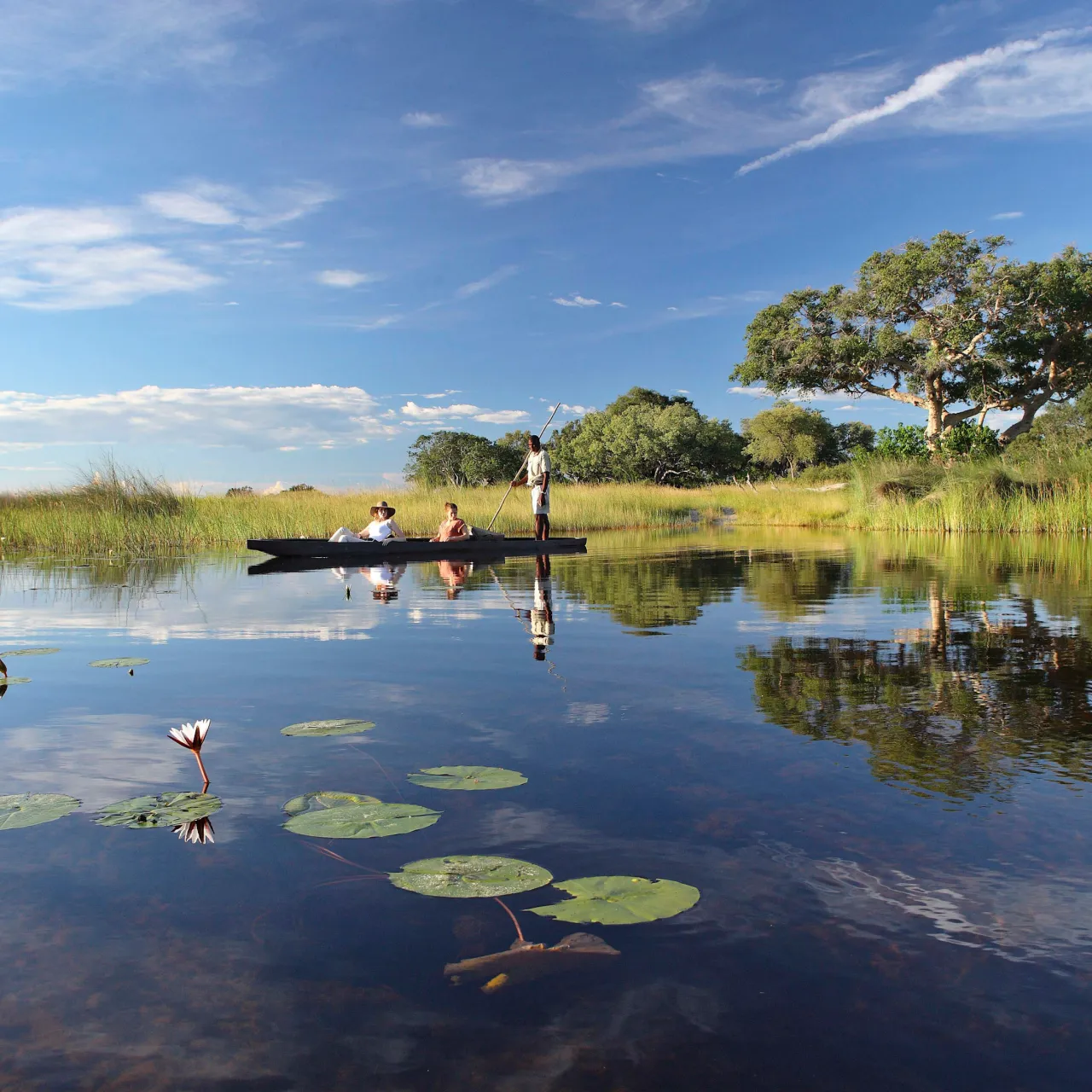 Botswana Xaranna Experience Mokoro ride guests lounging on the Mokoro High Resolution Width5000px