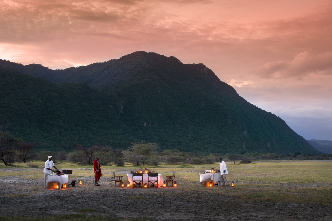 LODGE SHOT Tanzania Lake Manyara Tree Lodge Guest delight bush dinner at sunset 2