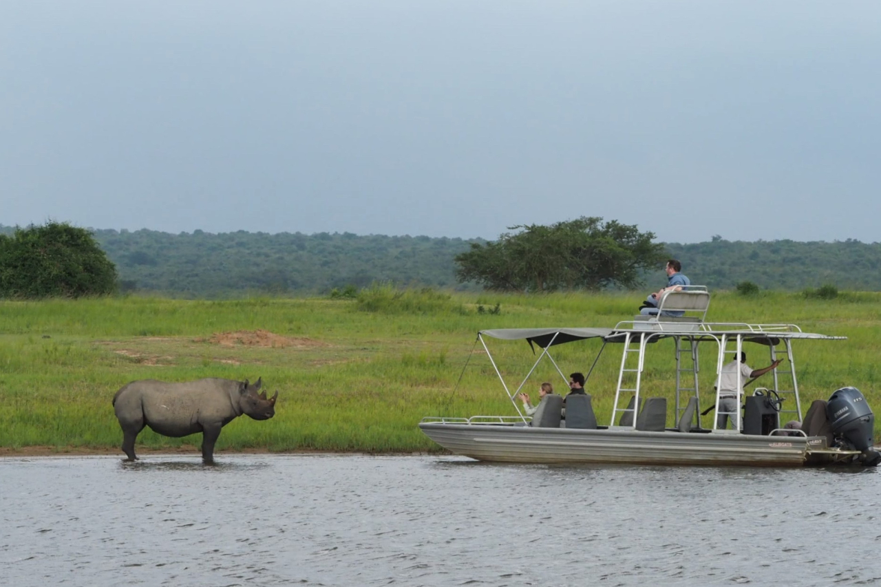 MAIN SHOT Wilderness Magashi Rhino and boat Isaac Kalio